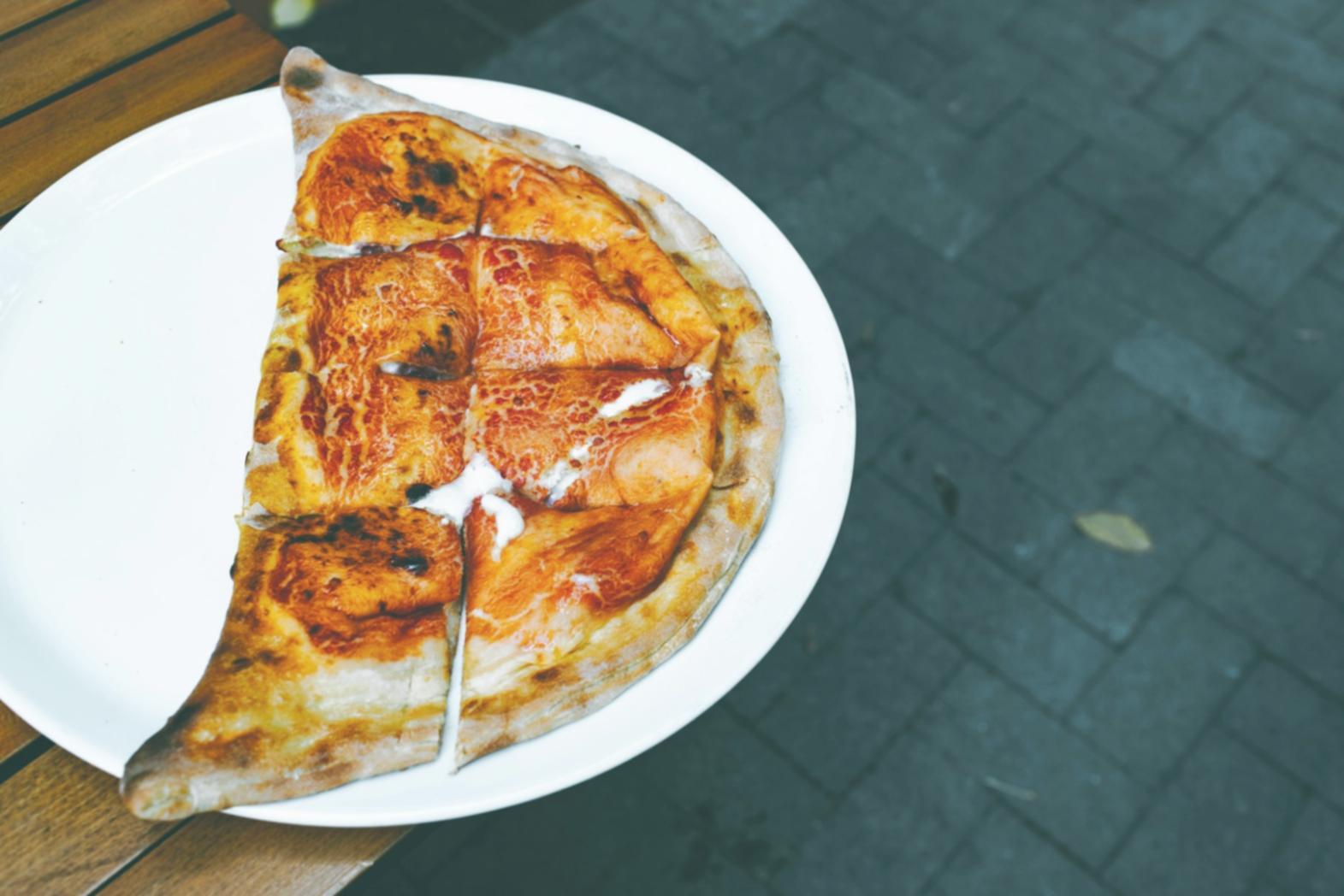 Kitchen workspace with plating reference materials and organized ingredients
