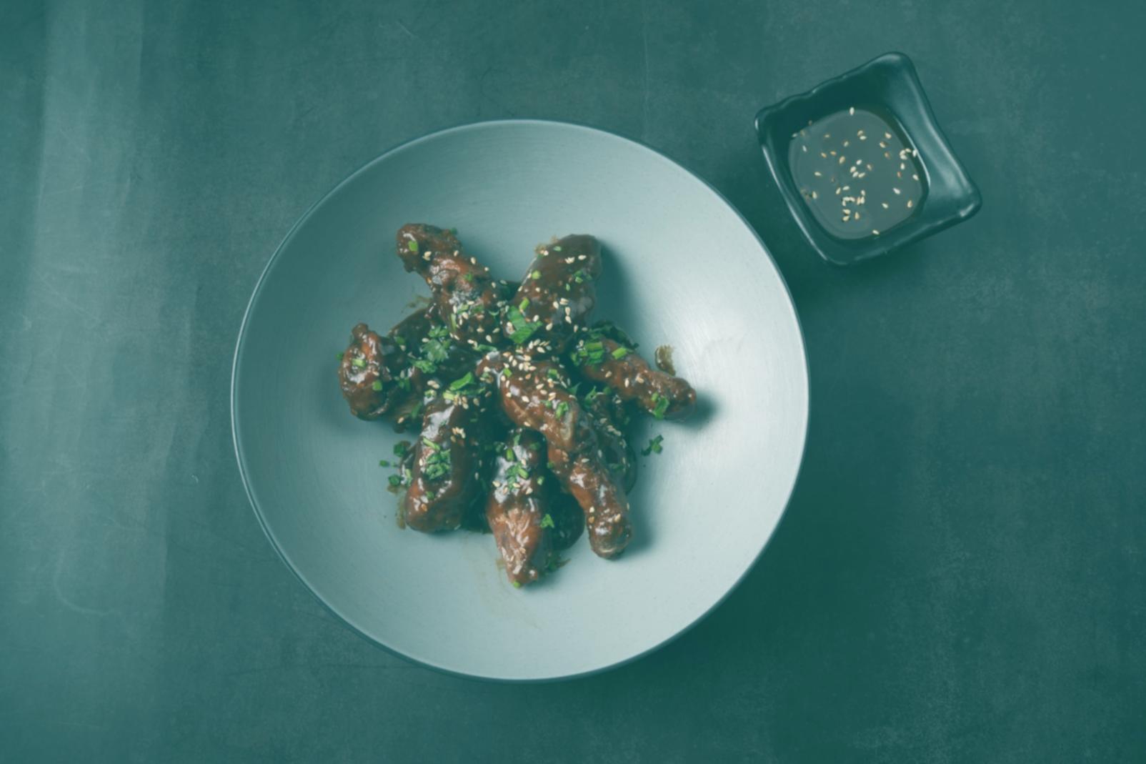 Professional chef demonstrating advanced plating techniques